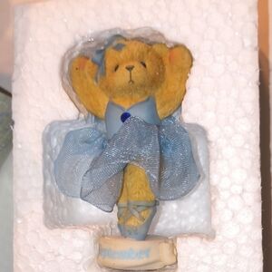 Adorable Yellow Bear Figurine with Blue Dress